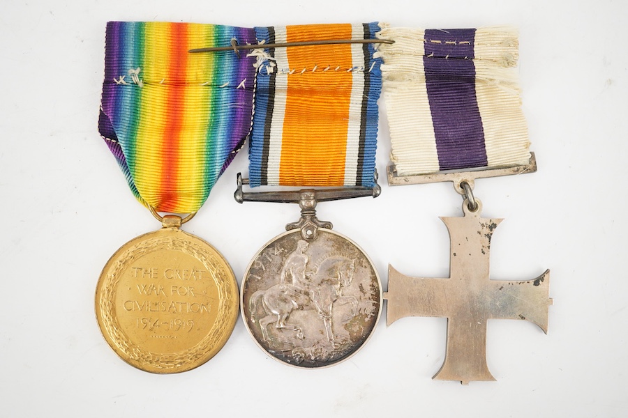 A George V First World War Military Cross (MC) medal group, comprising of a military cross, British war medal, and the victory medal. Condition - poor, the name of the recipient has been removed leaving only ‘W. York R.’